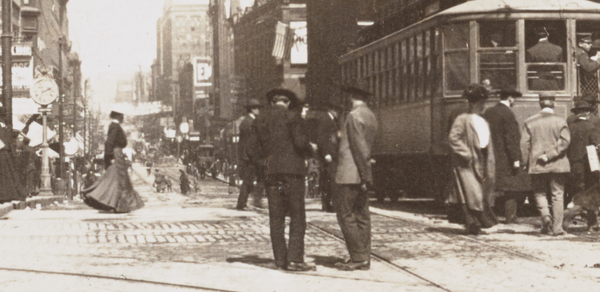 Seventh Street from Wabasha, St. Paul, Minn. Summary: People standing on street and curb; streetcar at right. 